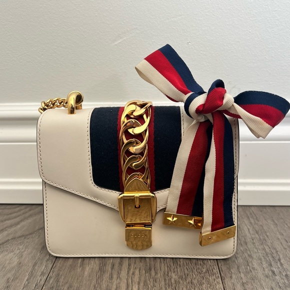 Gucci Handbags - Authentic Gucci Mini Sylvie Cream Crossbody Bag with Bow